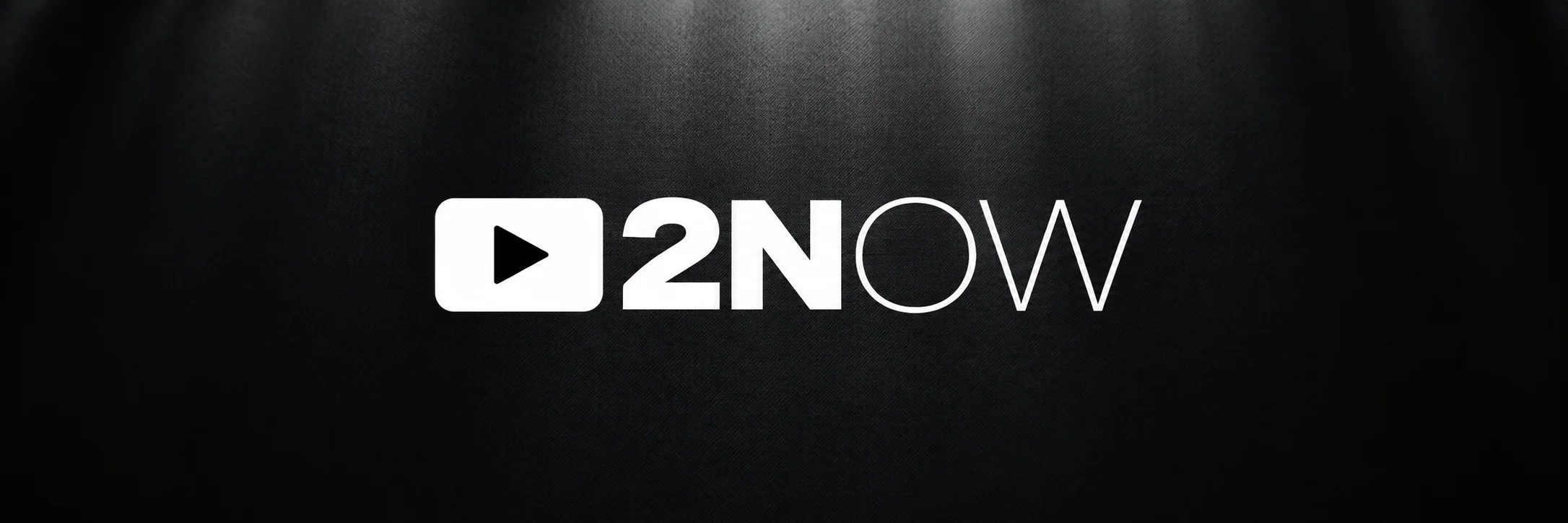 2NOW white play-screen logo on textured charcoal